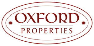 Logo of Oxford Properties in dark red with oval border.
